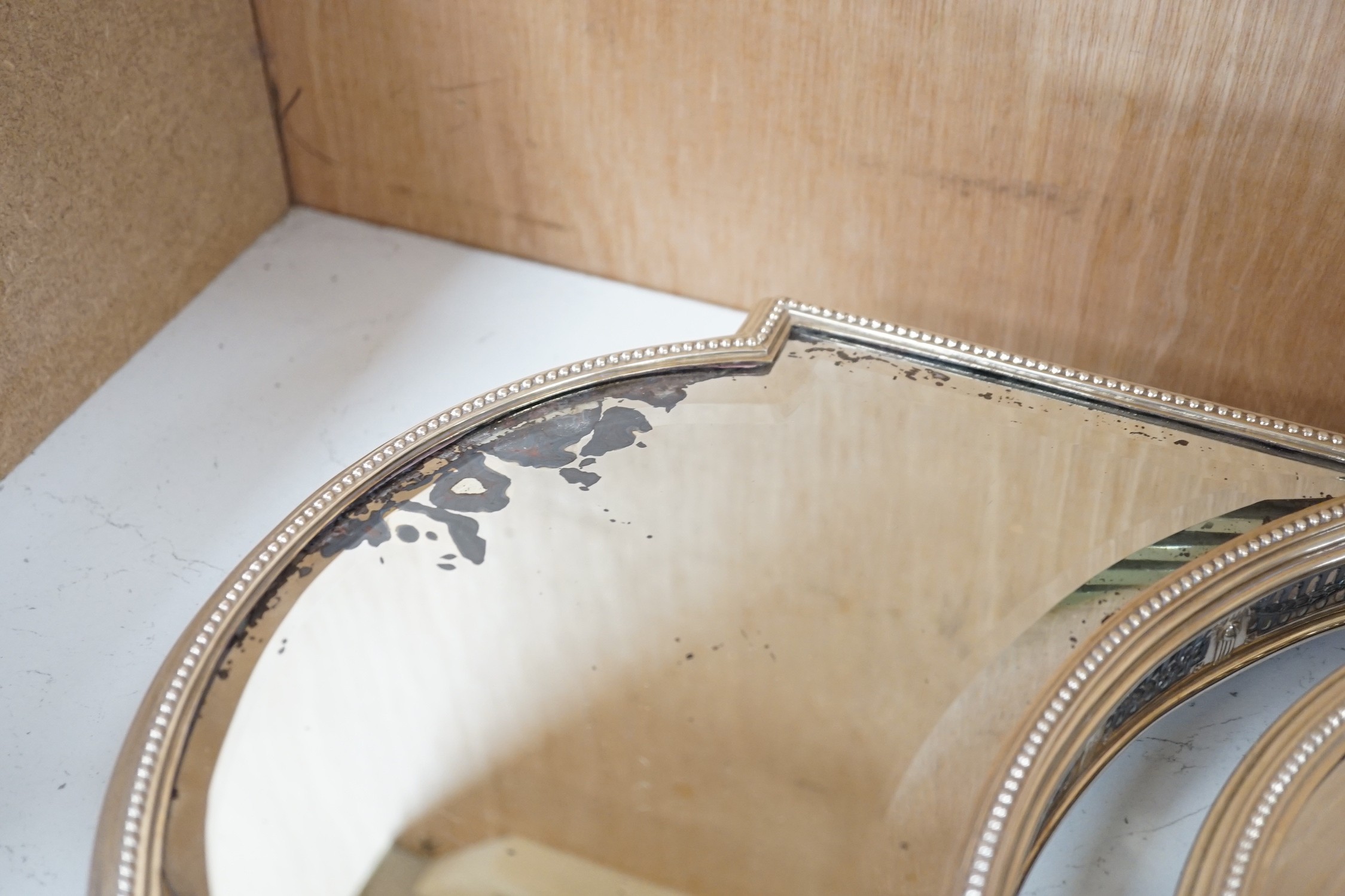 A silver-plated three-section mirrored plateau (surtout de table), by WMF, centre measures 53cm long